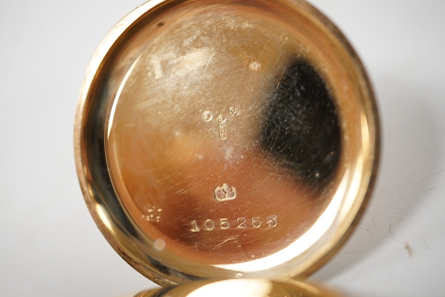 A George V 9ct gold open faced fob watch, with Roman dial and subsidiary seconds(hand loose), with 9ct gold cuvette, case diameter 34mm, gross weight 27.2 grams. Condition - poor to fair